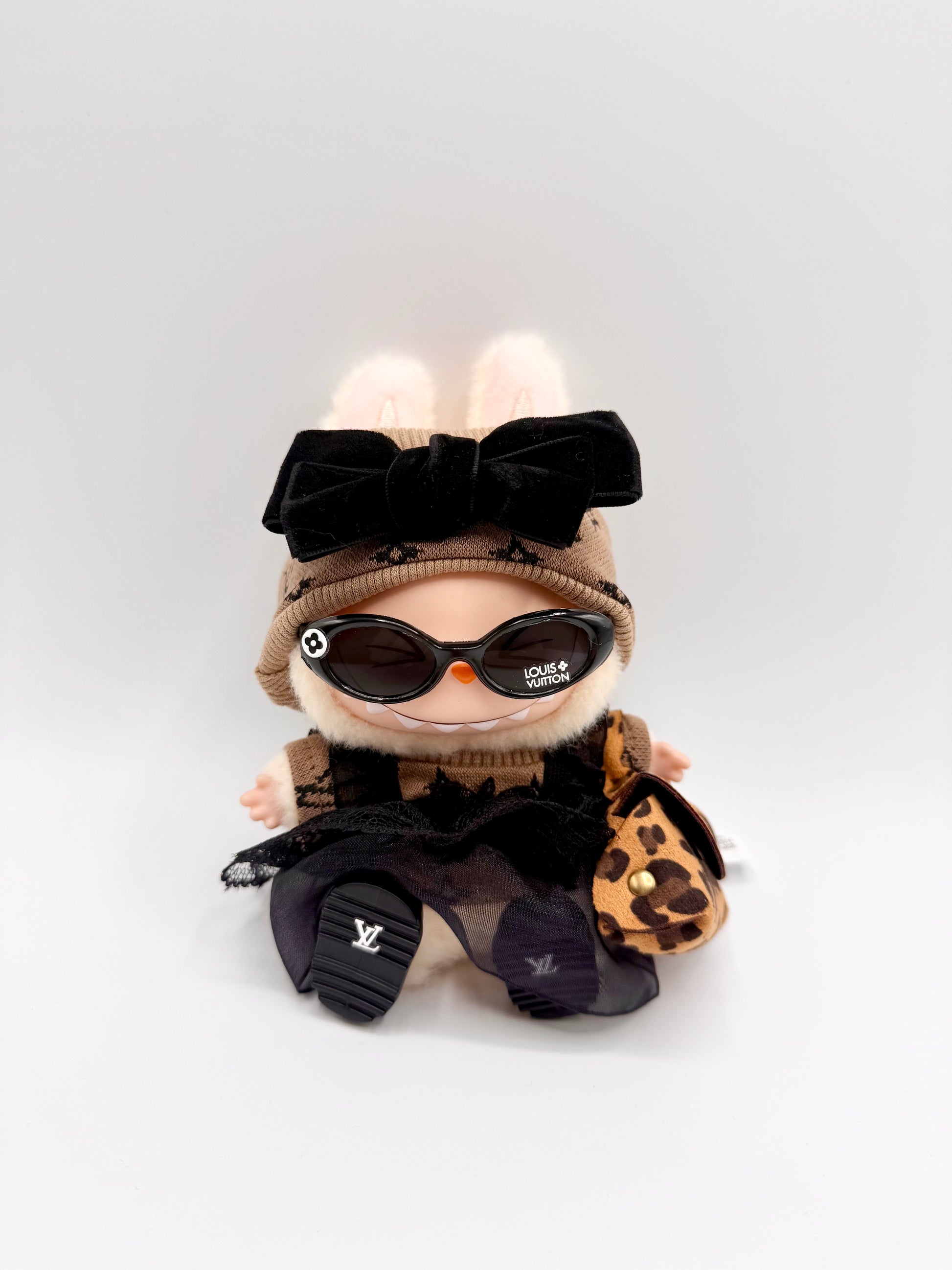 "Labubu doll brown LV bow dress set with velvet headband, sunglasses, lace-trimmed dress, leopard mini bag, and LV logo shoes – luxury collectible doll outfit"